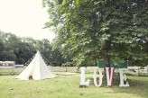 Festival themed wedding at Ridge Farm, Sussex. Photo by Emma Lucy Photography.