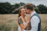 Cool Tattooed B&G Wedding at FForest wearing headpiece(s) from Curious Fair