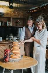 Cool Tattooed B&G Wedding at FForest wearing headpiece(s) from Curious Fair