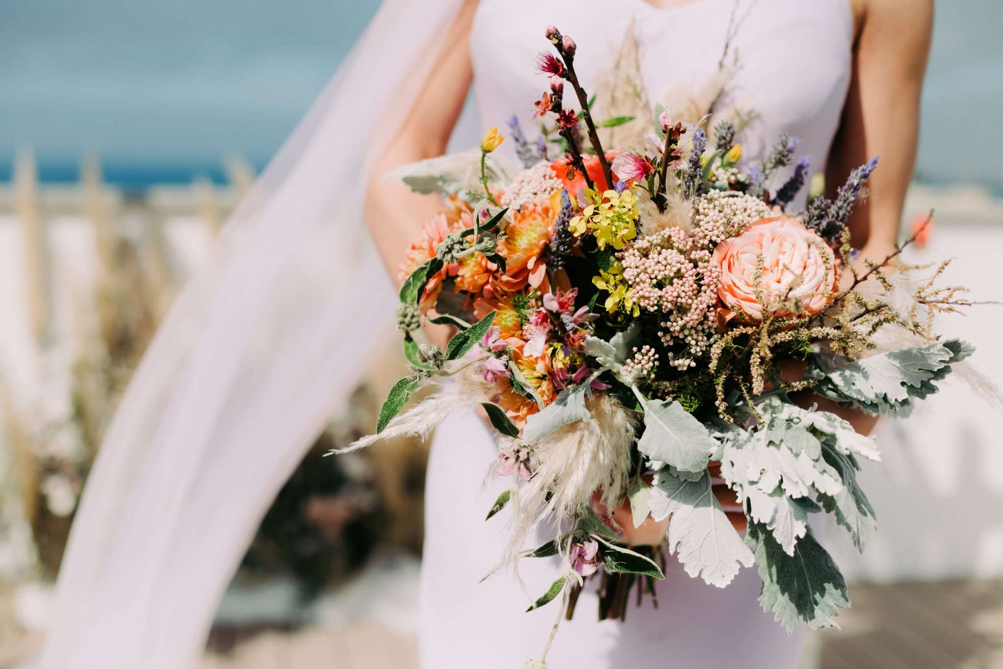 Practical advice for planning a destination wedding that feels personal, from choosing the right location and local planner to guest travel, weather and venue packages